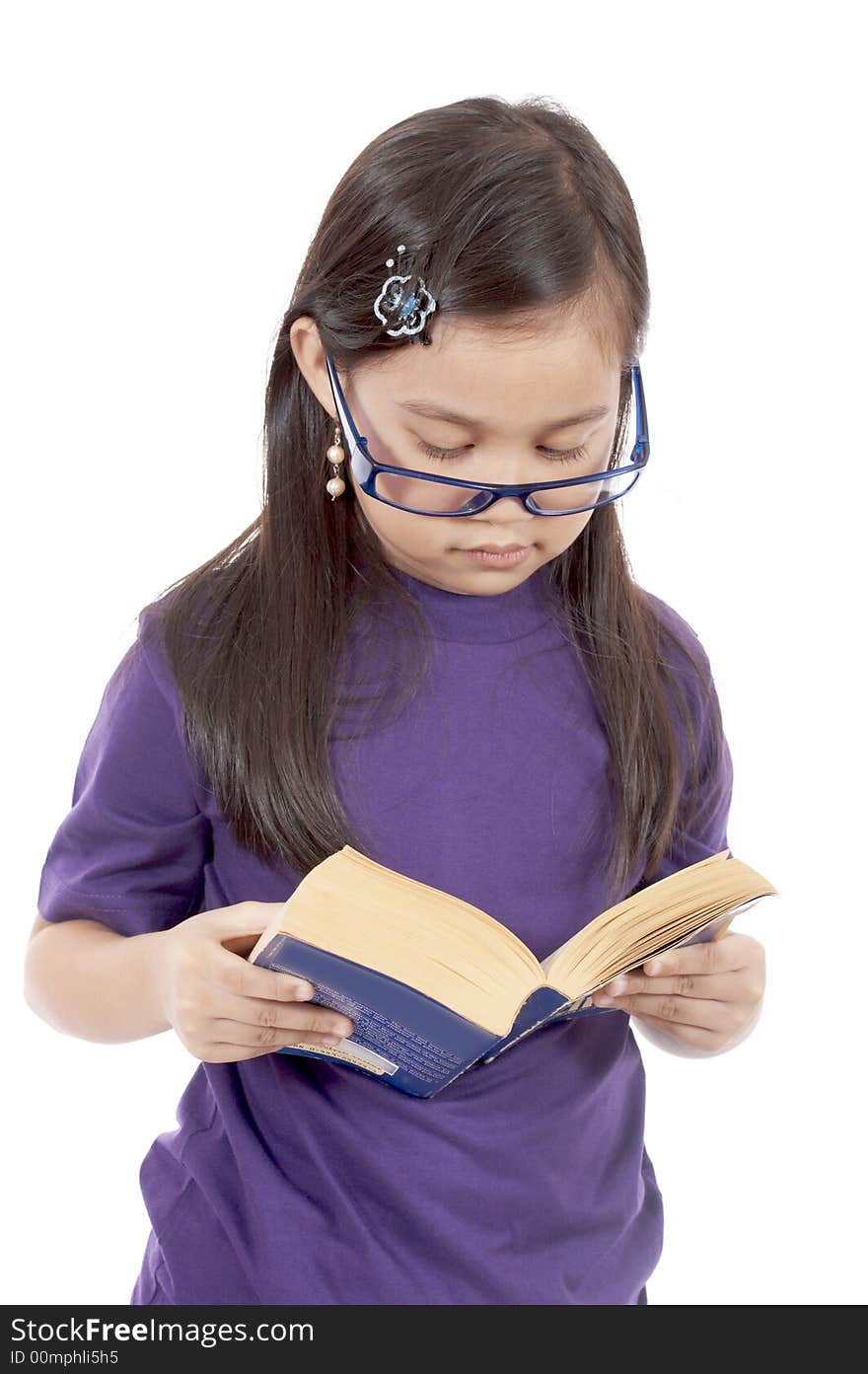 A young girl reading a book over a white background