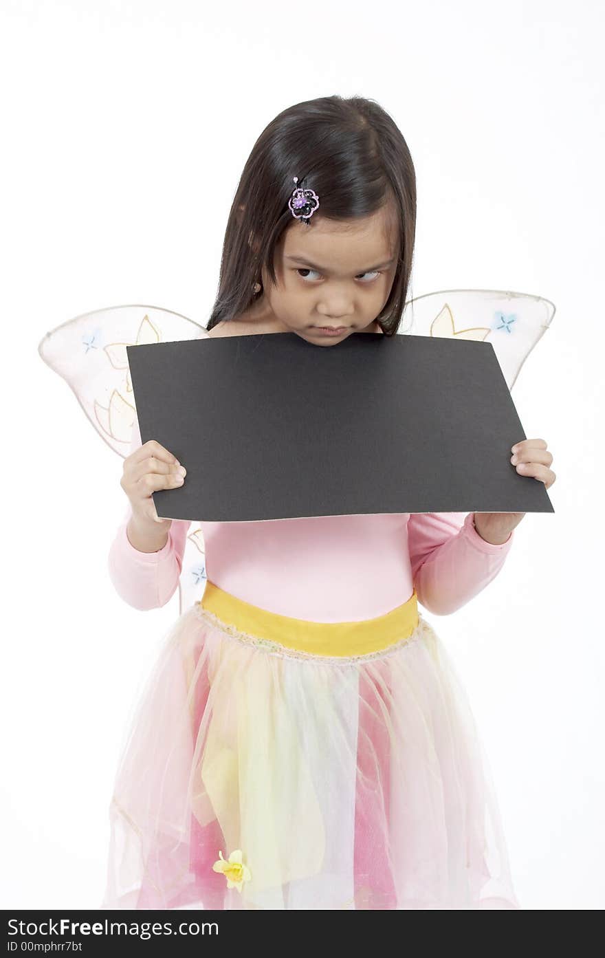 A girl holding a blank placard over a white background. A girl holding a blank placard over a white background