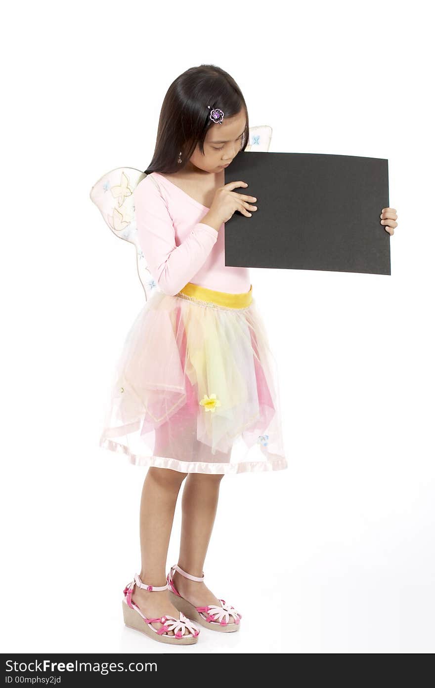 A girl holding a blank placard over a white background. A girl holding a blank placard over a white background