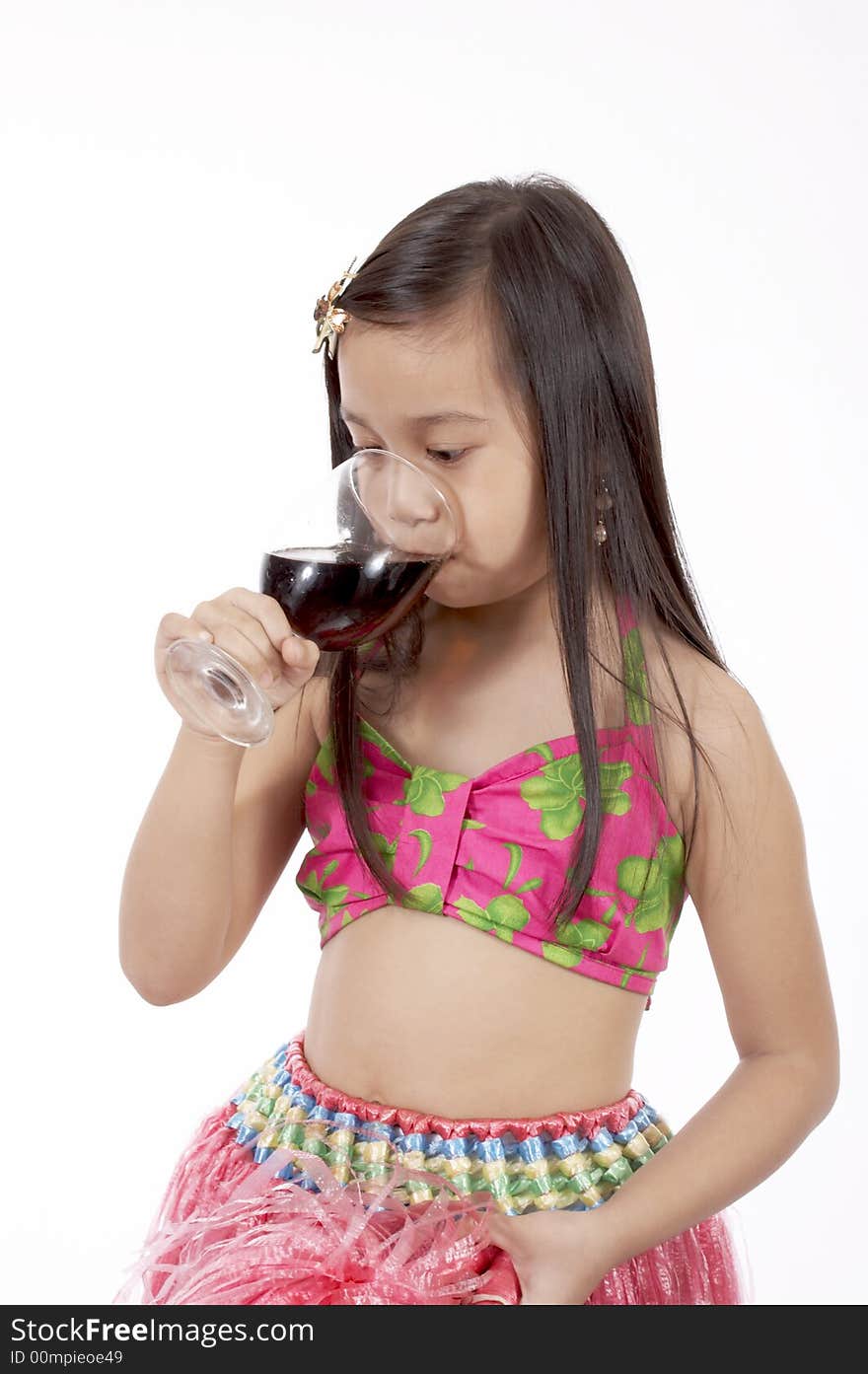 A girl wearing a hawaiian costume over a white background