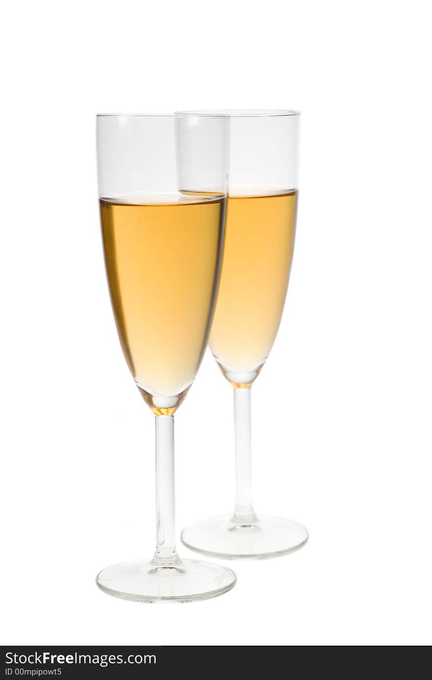 Two glasses filled with champagne isolated on a white background. Two glasses filled with champagne isolated on a white background