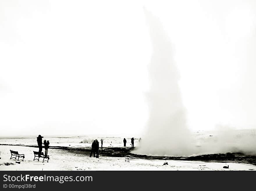 Geyser erupting christmas tree silhouette, december, Iceland. Geyser erupting christmas tree silhouette, december, Iceland