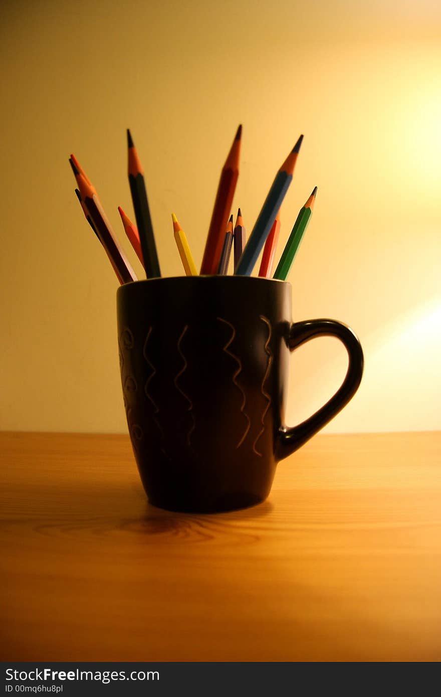 A cup of  color pencils on my table. A cup of  color pencils on my table