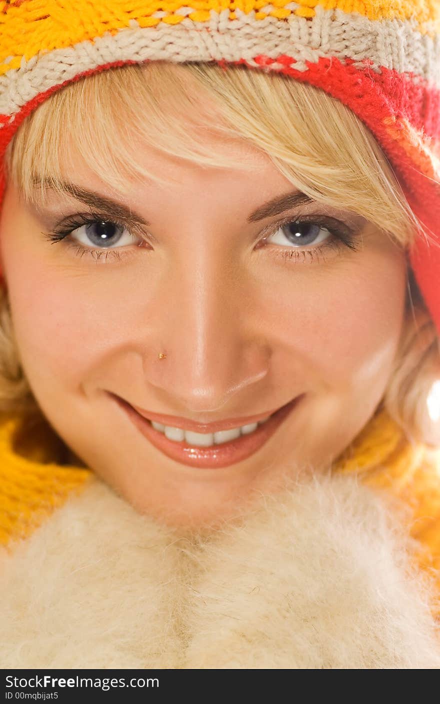 Sweet girl in winter clothing close-up portrait