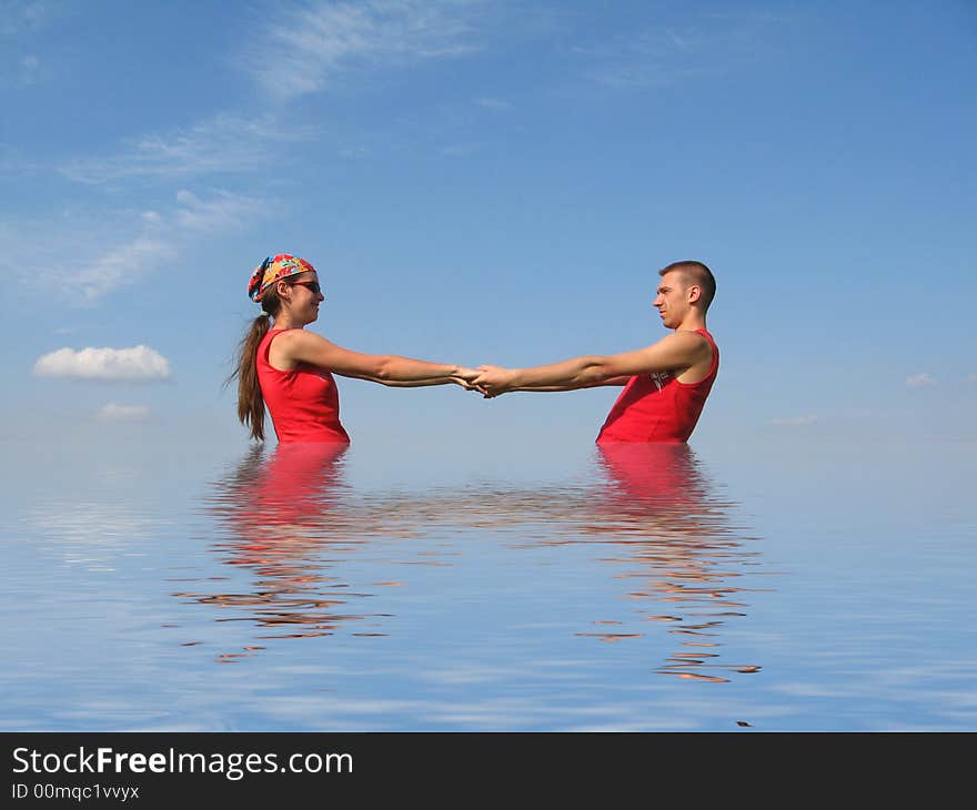 Whizzing couple in the water reflected. Whizzing couple in the water reflected