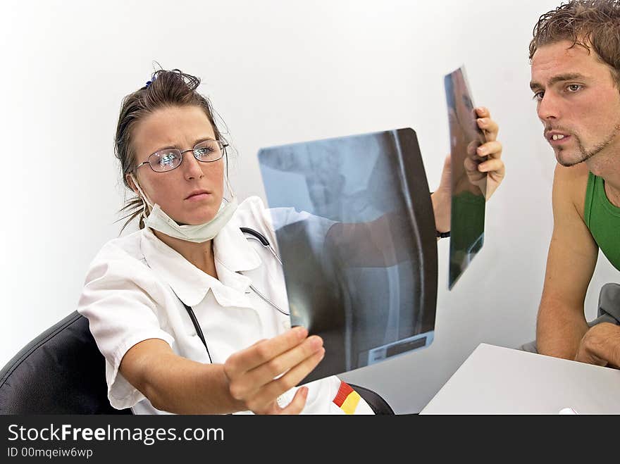 Young female doctor looking radiogram. Young female doctor looking radiogram