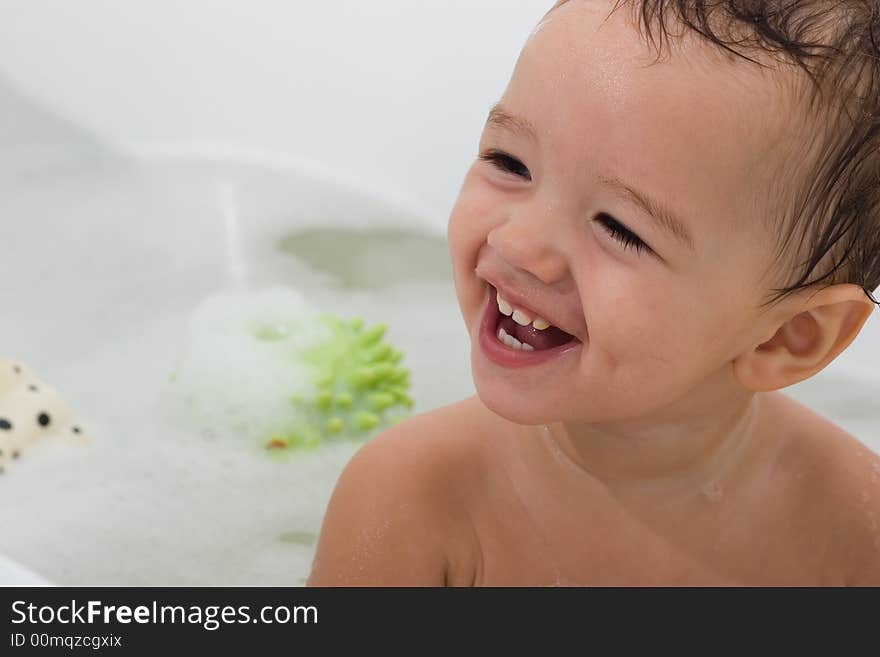 Happy Child is bathing with toys. Happy Child is bathing with toys