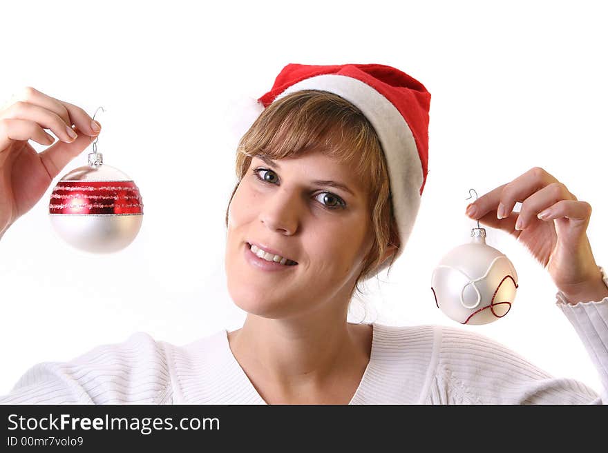 A young beautiful cute and happy Christmas woman is smiling. Isolated over white with a Christmas glitter balls. A young beautiful cute and happy Christmas woman is smiling. Isolated over white with a Christmas glitter balls.