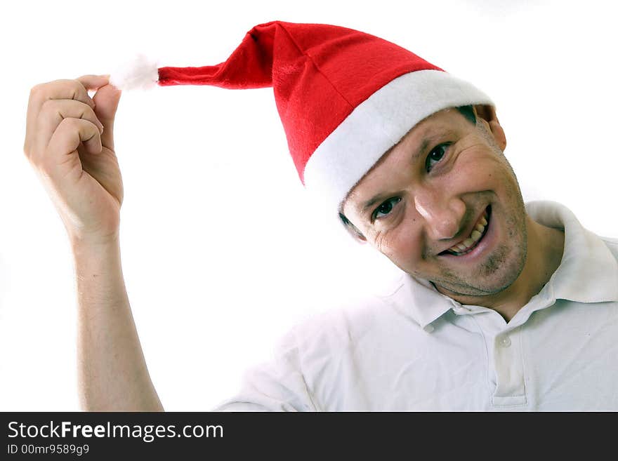 A young man with a santa claus hat is smiling. Isolated over white! Lots of copyspace to write text in!. A young man with a santa claus hat is smiling. Isolated over white! Lots of copyspace to write text in!