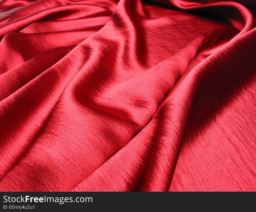 Soft,red,reflective satin background. Soft,red,reflective satin background