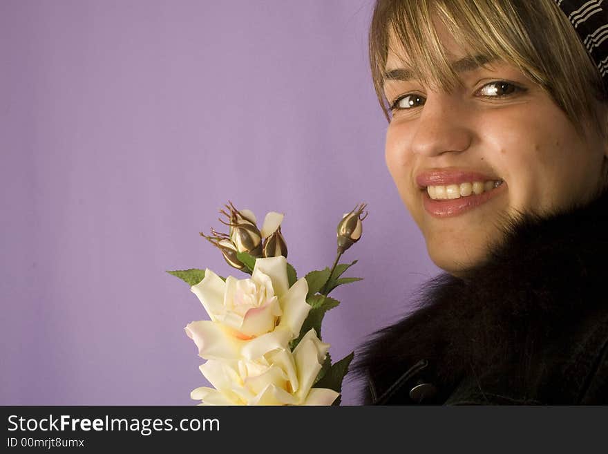 Portrait of a young attractive woman with roses