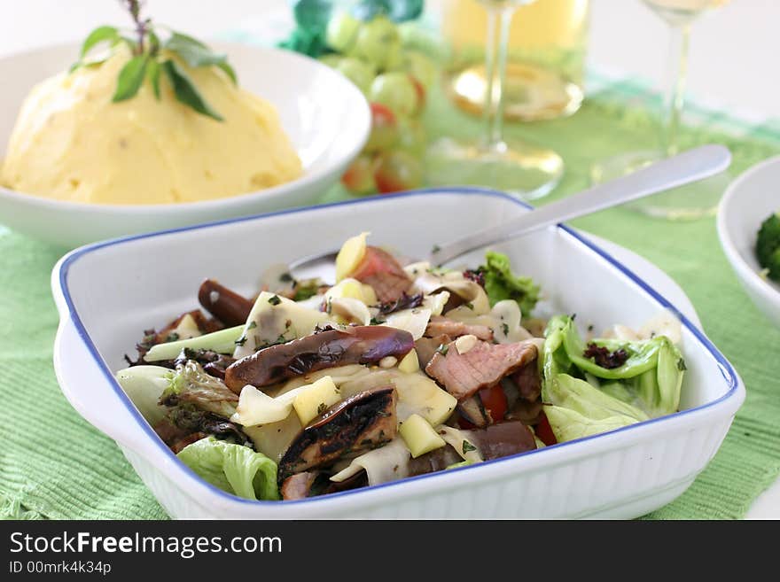 Healthy and light mushroom, fresh lettuce, brinjal and sliced grilled beef salad