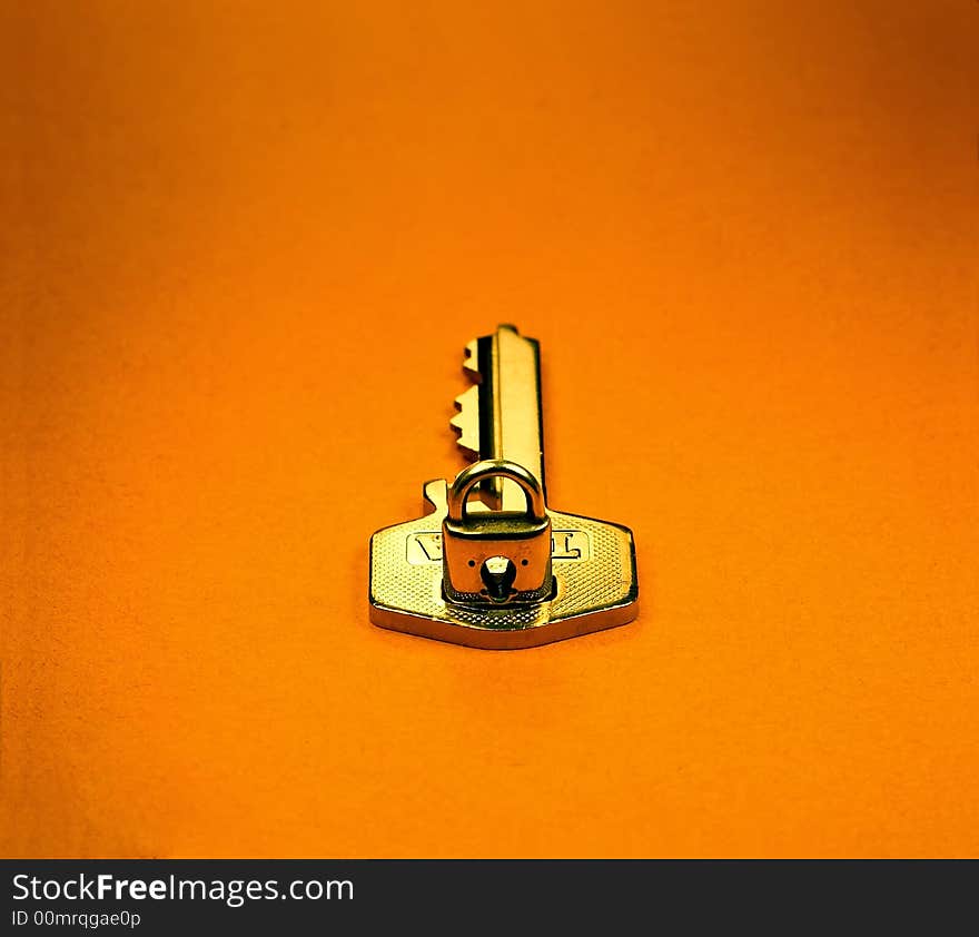 Shiny key and miniature lock. Shiny key and miniature lock