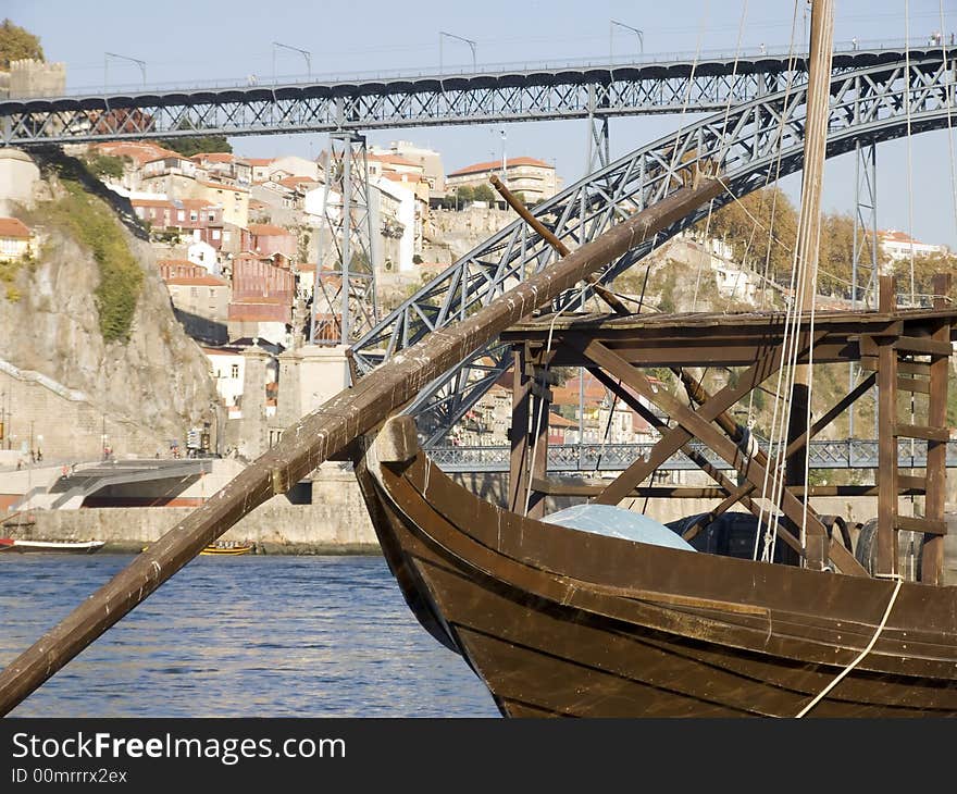 Cityscape with a typical porto wine rebelo boat in the foreground. Cityscape with a typical porto wine rebelo boat in the foreground