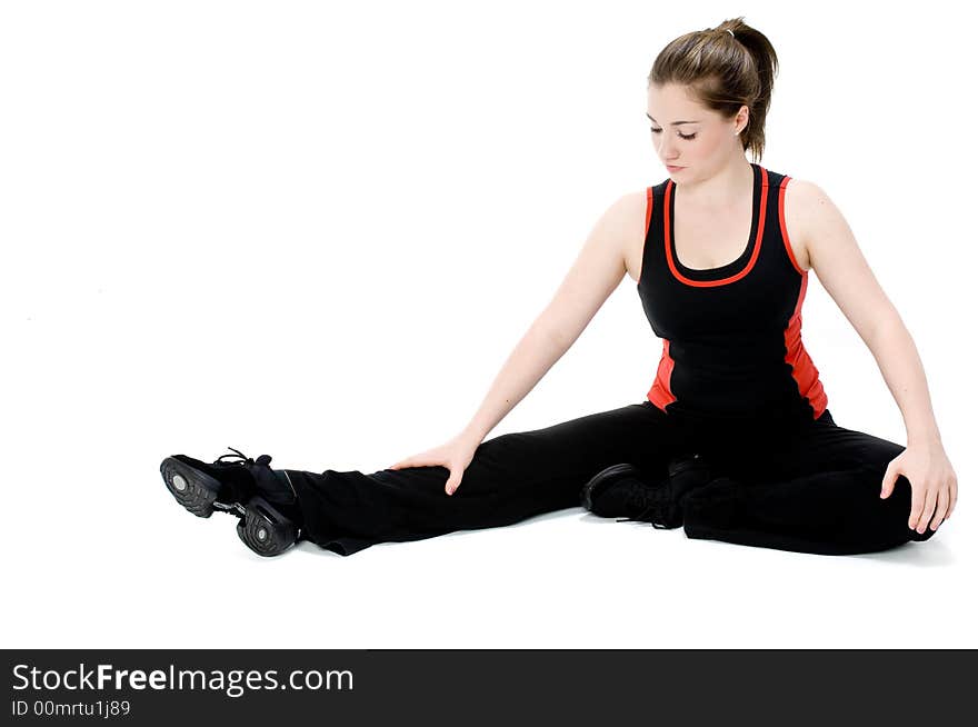 A young caucasian girl doing different stretches. A young caucasian girl doing different stretches