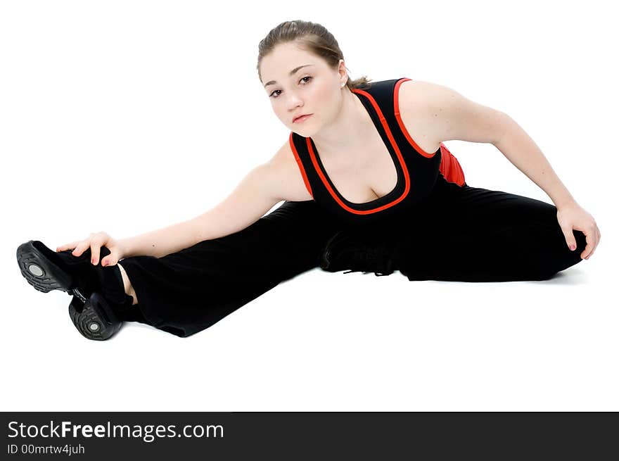 A young caucasian girl doing different stretches. A young caucasian girl doing different stretches