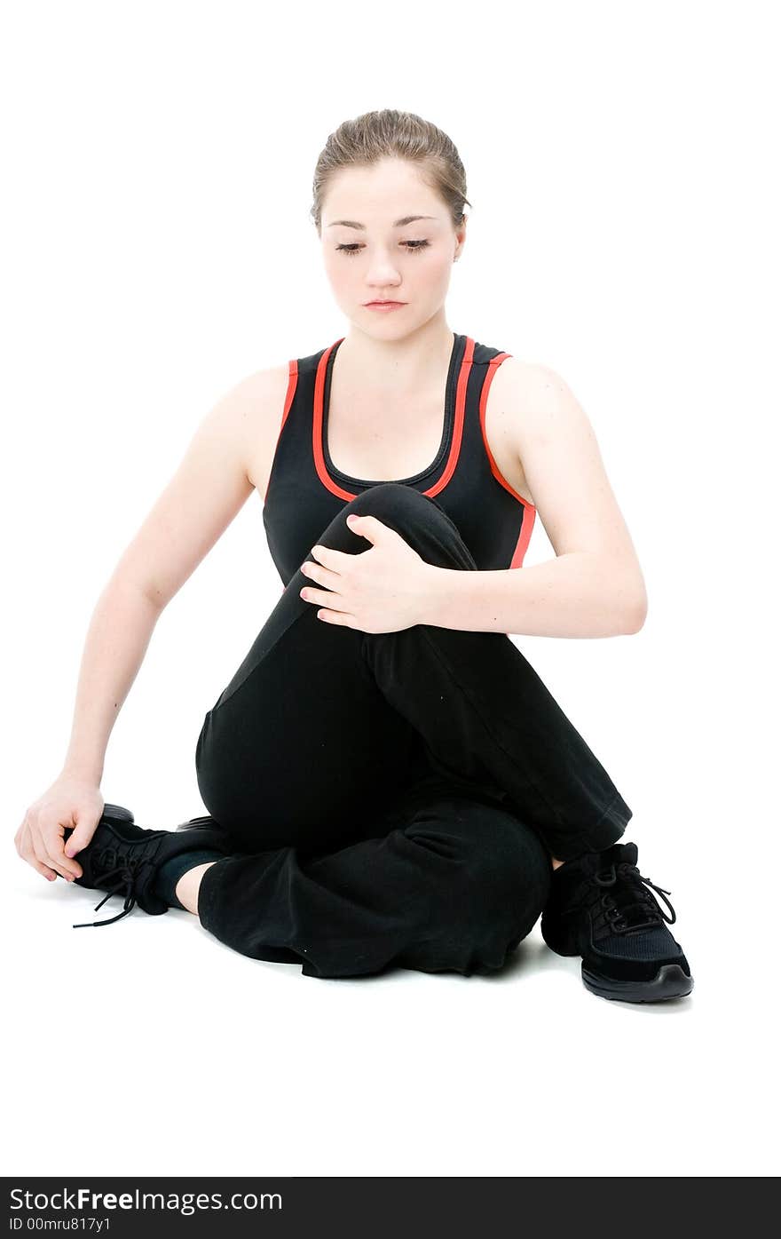 A young caucasian girl doing different stretches. A young caucasian girl doing different stretches