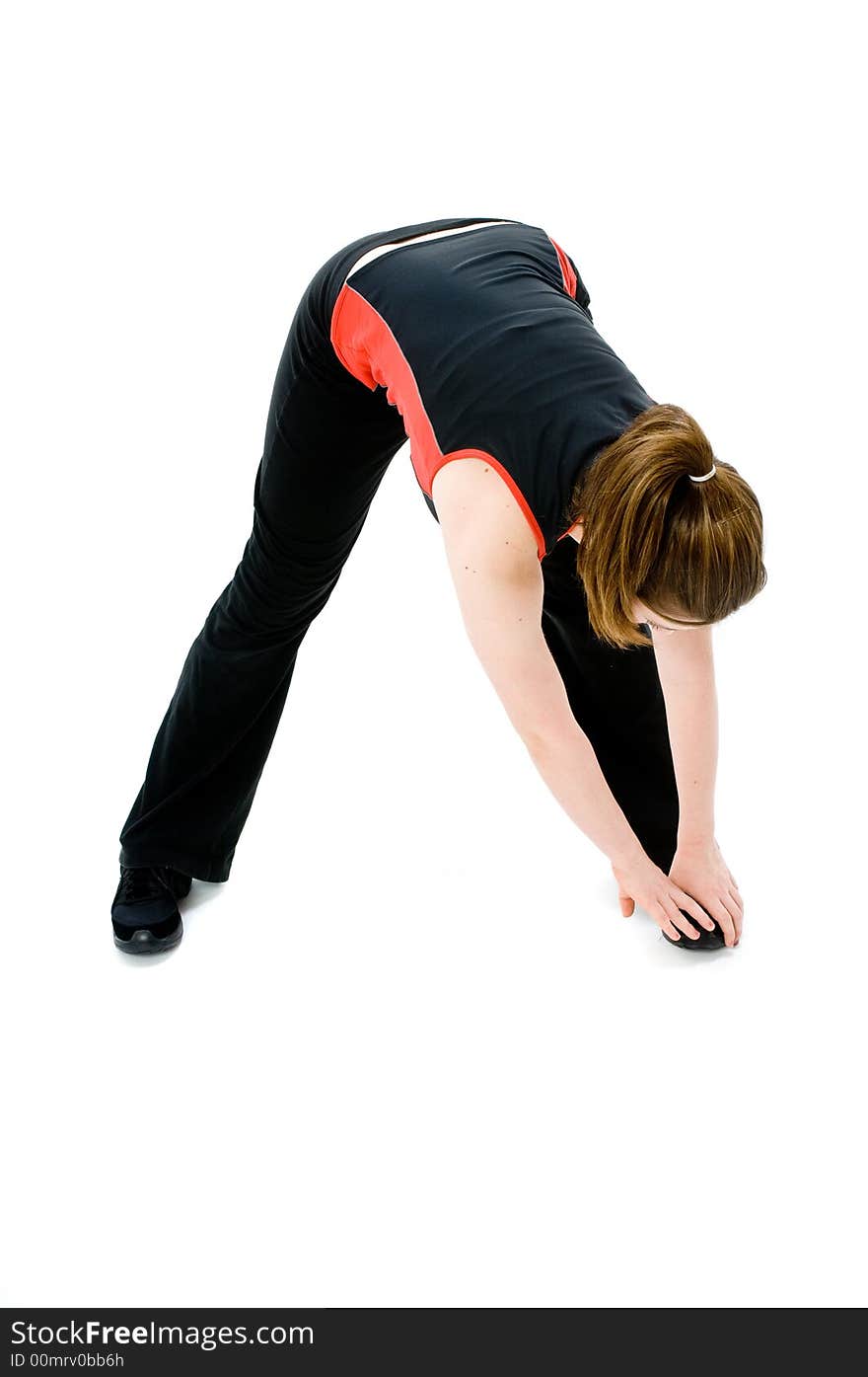 A young caucasian girl doing different stretches. A young caucasian girl doing different stretches