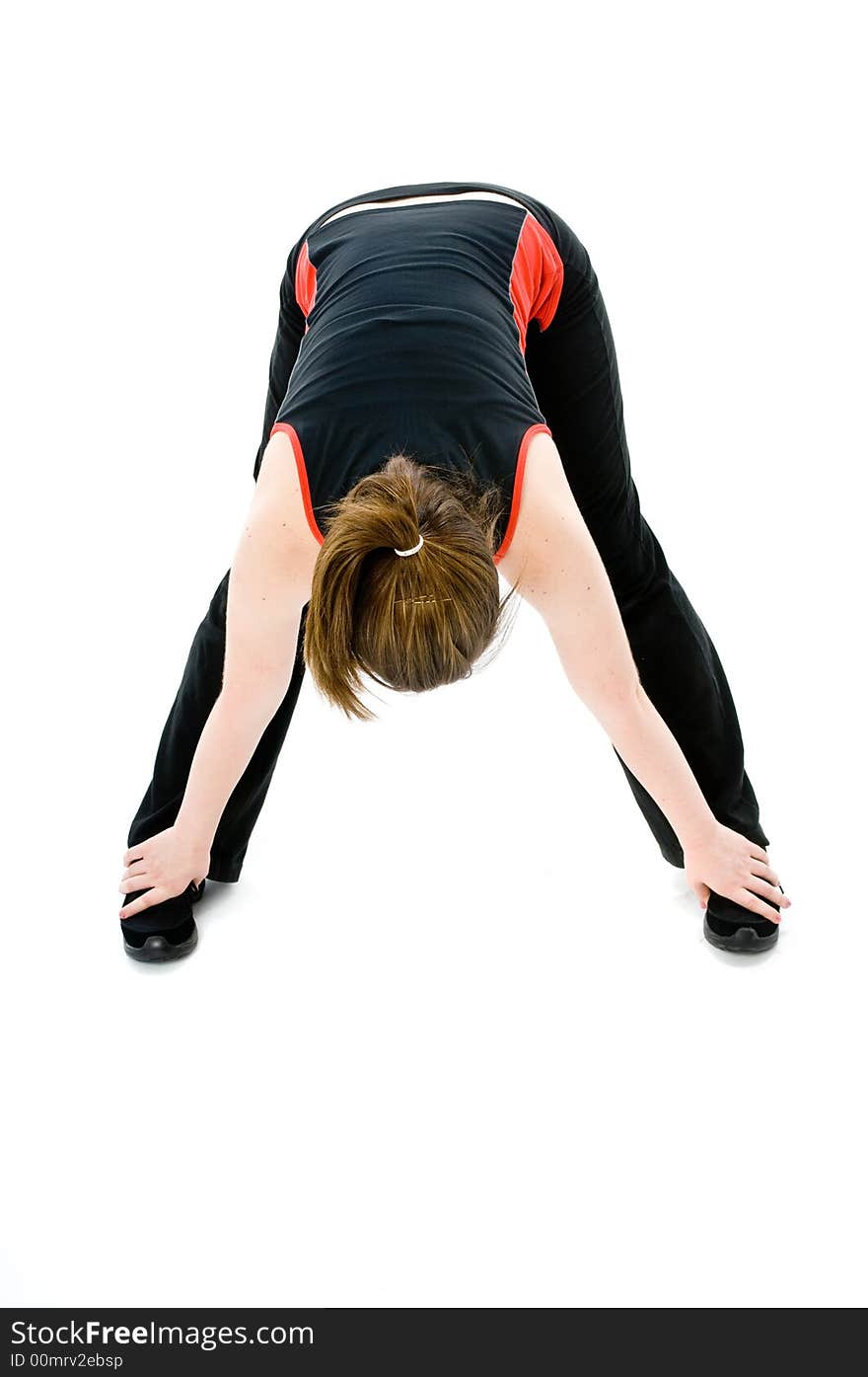 A young caucasian girl doing different stretches. A young caucasian girl doing different stretches