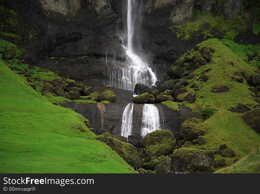 Waterfall and green hills