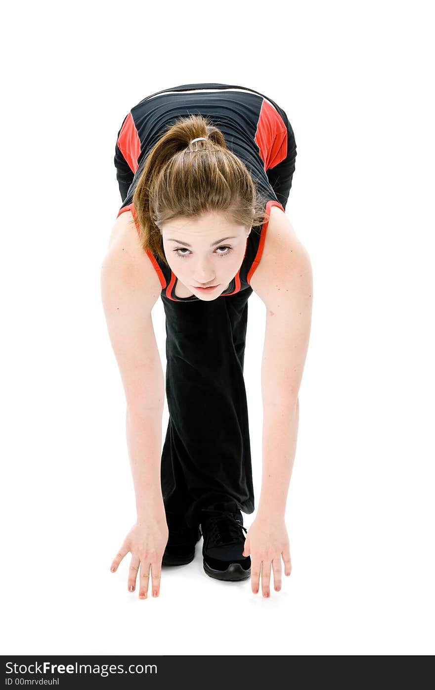 A young caucasian girl doing different stretches. A young caucasian girl doing different stretches