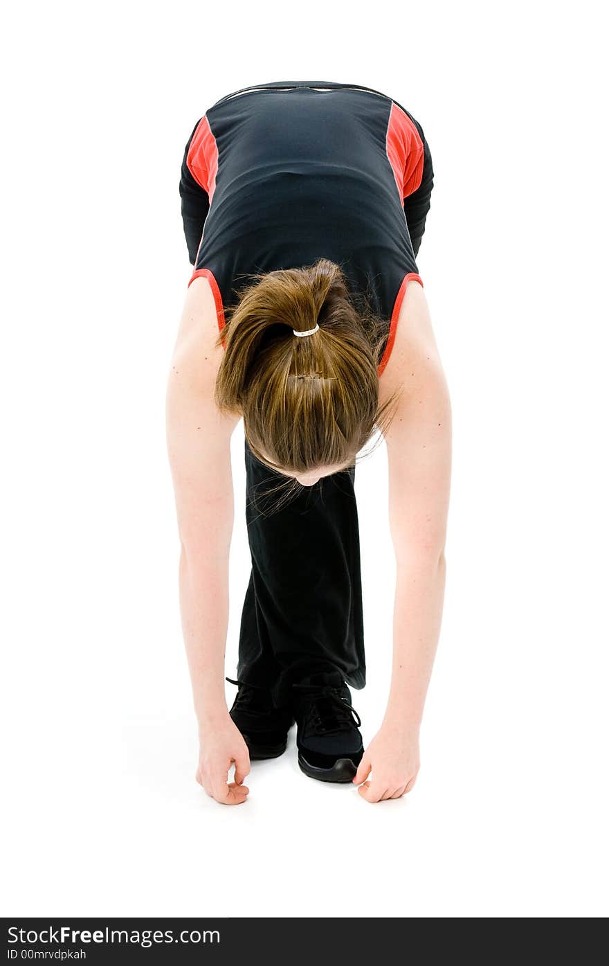 A young caucasian girl doing different stretches. A young caucasian girl doing different stretches