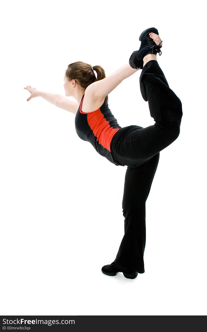 A young caucasian girl doing different stretches. A young caucasian girl doing different stretches