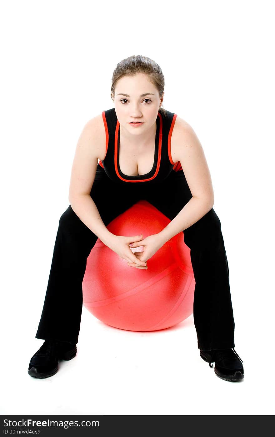 A young caucasian girl doing different stretches. A young caucasian girl doing different stretches