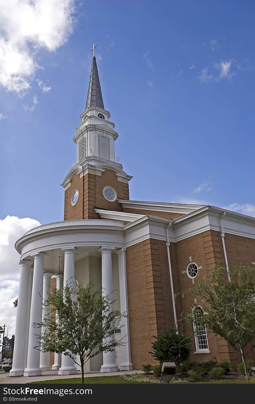 A large traditional chuch with columns and steeple. A large traditional chuch with columns and steeple