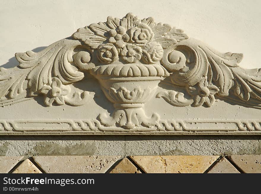 Ornate Design Element on Stucco Wall