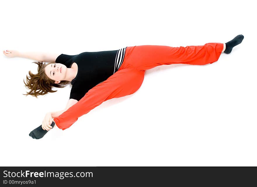 A young caucasian girl doing different stretches. A young caucasian girl doing different stretches