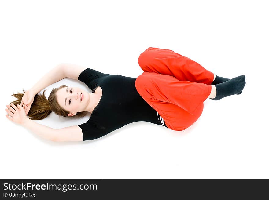 A young caucasian girl doing different stretches. A young caucasian girl doing different stretches