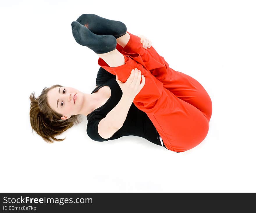 A young caucasian girl doing different stretches. A young caucasian girl doing different stretches