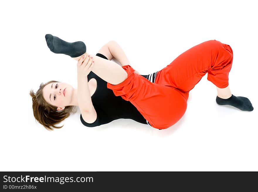 A young caucasian girl doing different stretches. A young caucasian girl doing different stretches