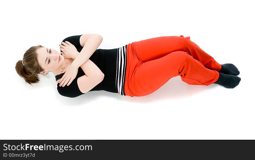 A young caucasian girl doing different stretches. A young caucasian girl doing different stretches