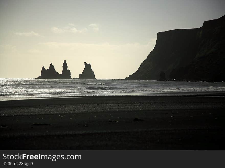 Silhouetted sea stacks