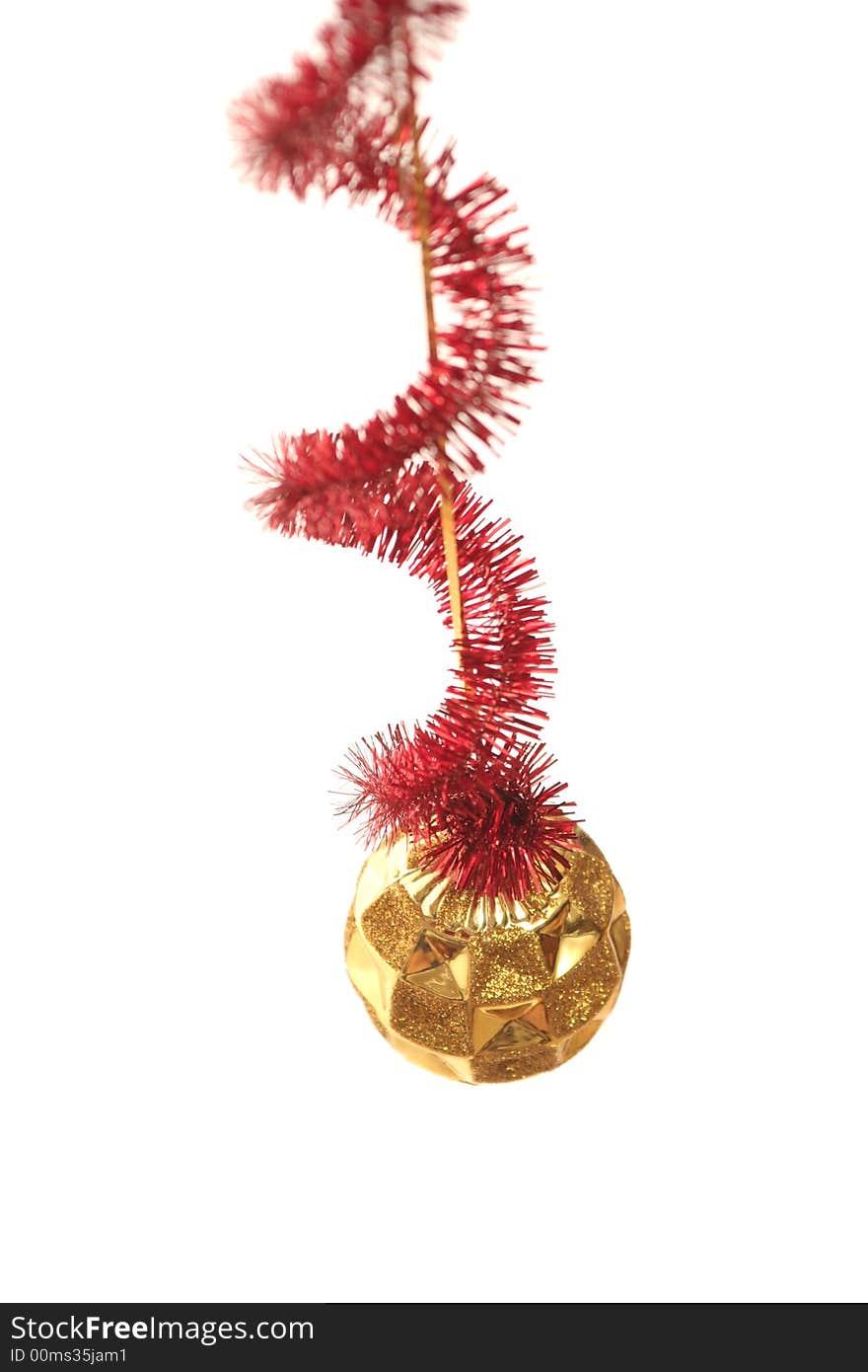 Red New Year's tinsel and gold sphere