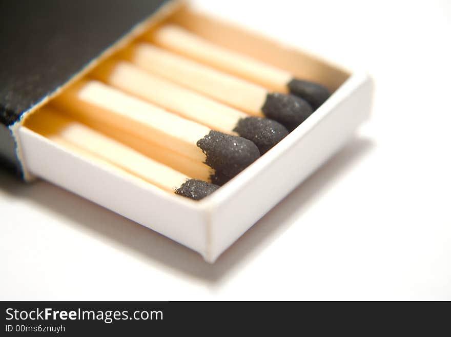 A few, macro isolated matchsticks