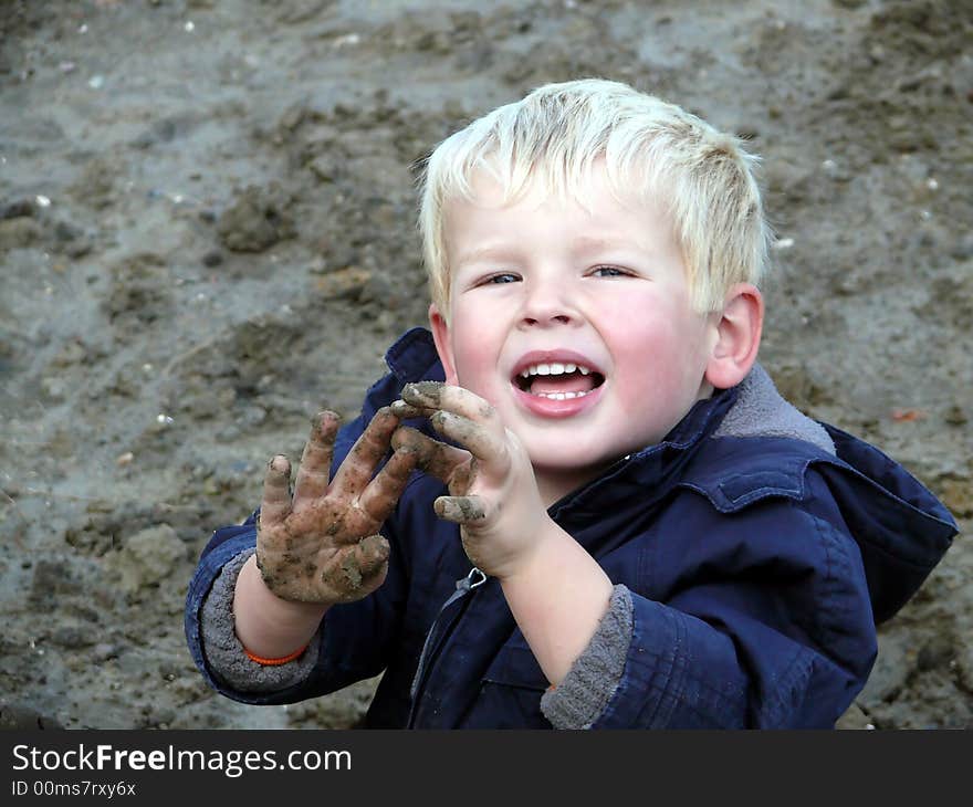 Toddler playing in the sand. Toddler playing in the sand