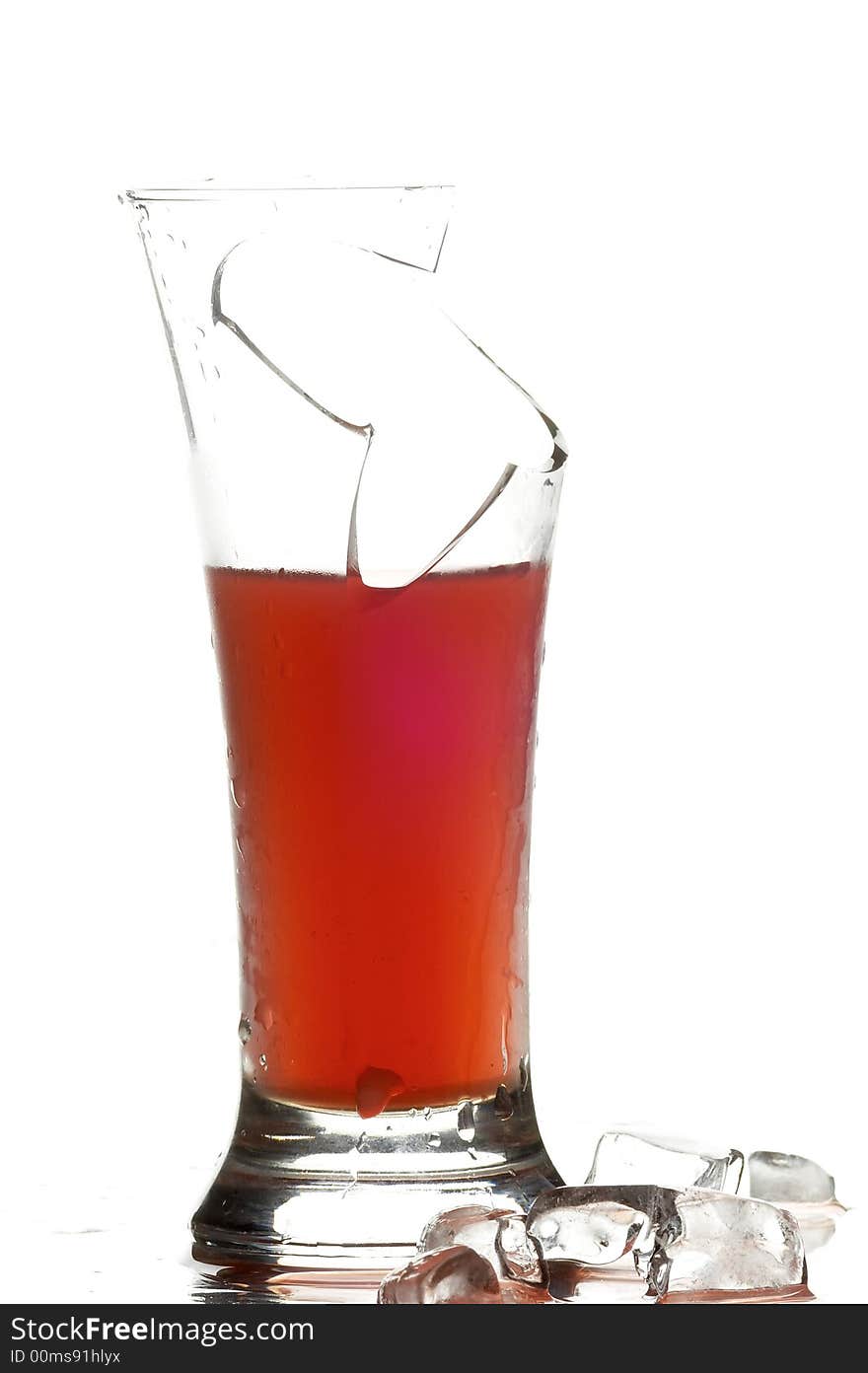 Glass with juice on the white background