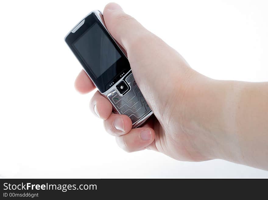 Small Silver Mobile Phone Device in hand. Small Silver Mobile Phone Device in hand