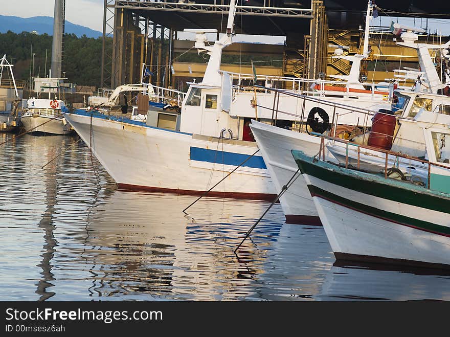 Fishing boats are at rest in an italian port