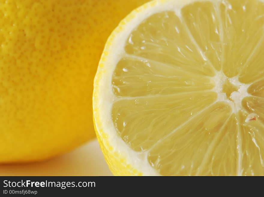 Fresh lemons in closeup background