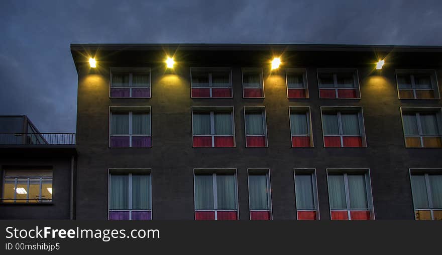 Detail of an hotel facade with colored window