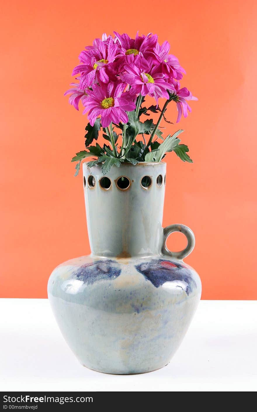 Vase of pretty pink flowers. Vase of pretty pink flowers.