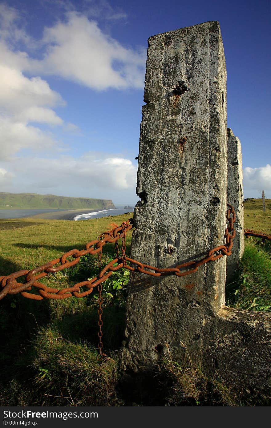 Posts and chain view to sea stacks Iceland