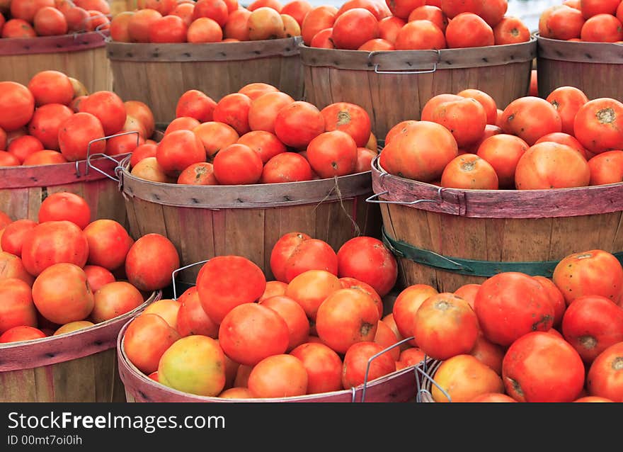 Tomatoes in baskets at the farm stand