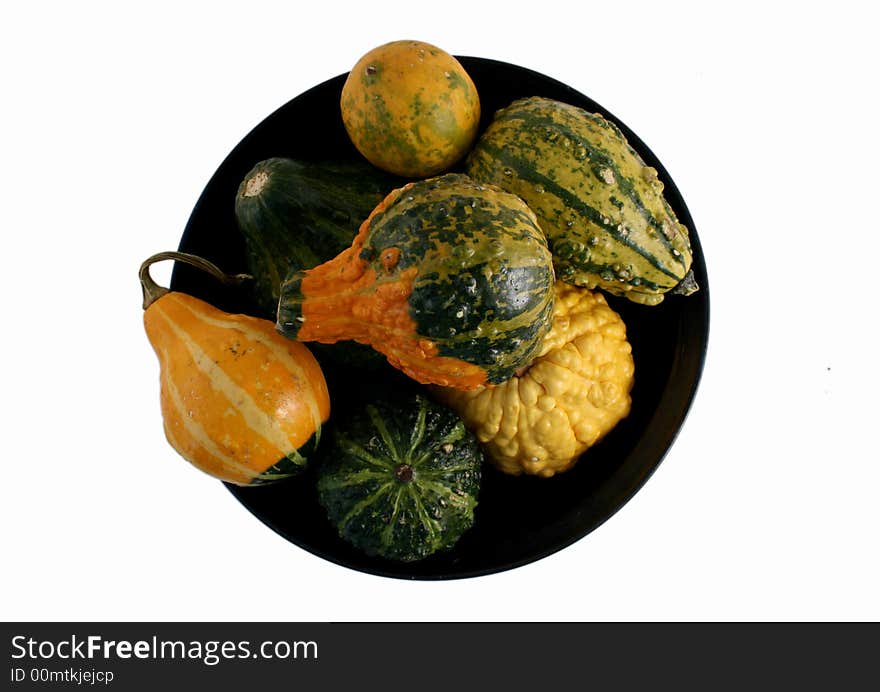 Isolated bowl of various squash on white background. Isolated bowl of various squash on white background