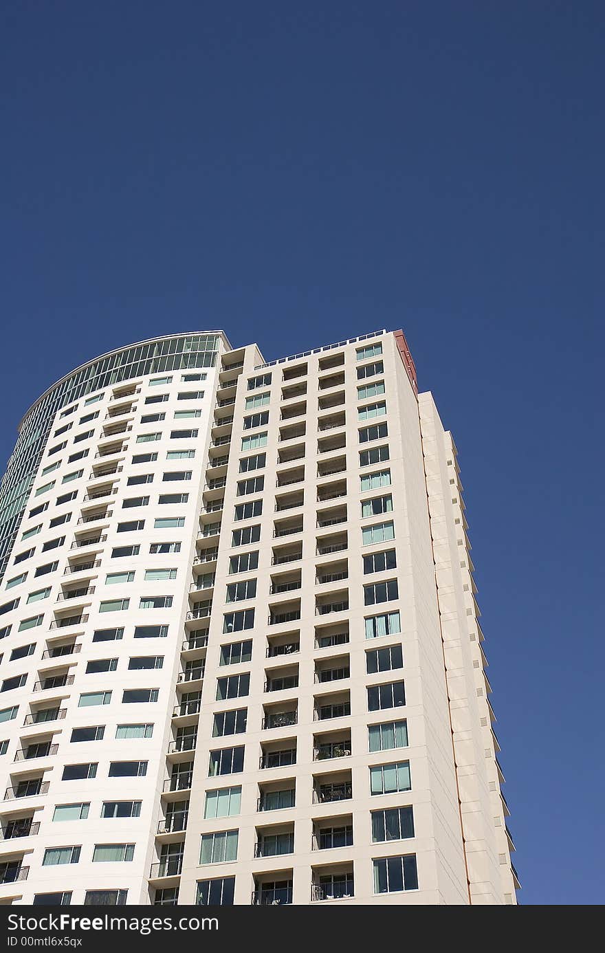 A high rise condo againat a blue sky. A high rise condo againat a blue sky