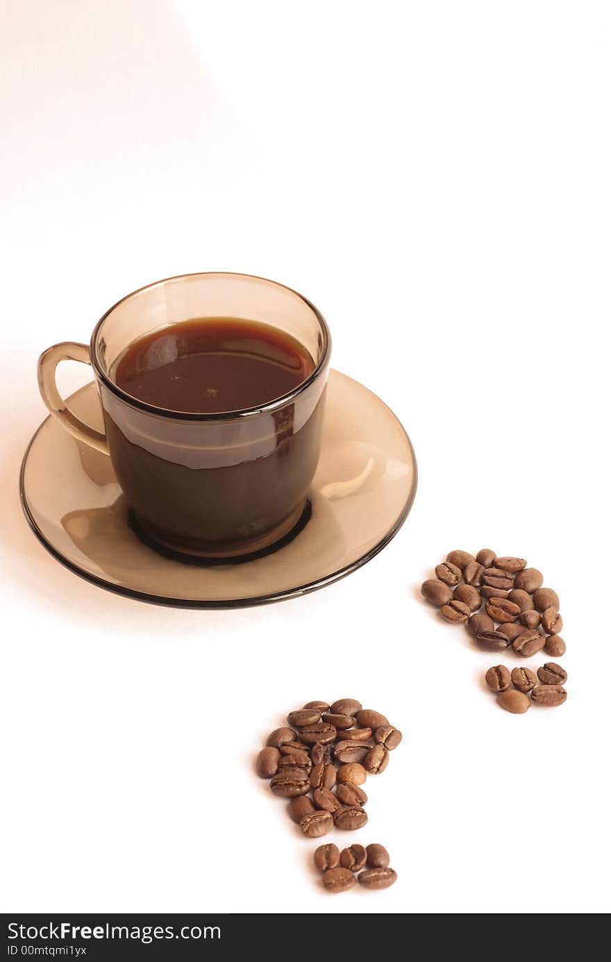 Cup of coffee and footprint from coffee beans